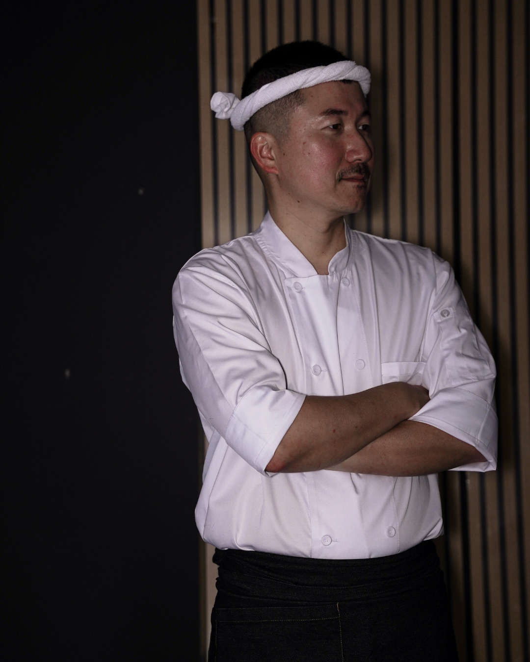 BUTAOK chef in white kitchen whites with a hachimaki headband